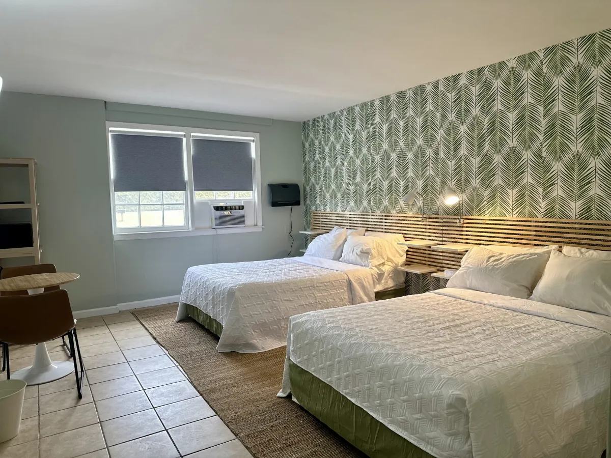 Double room with palm-leaf wallpaper