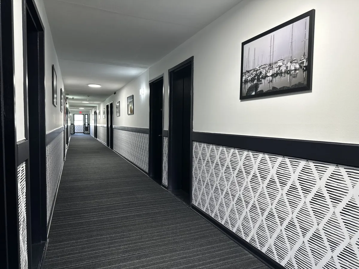 Refreshed interior corridor with coastal photography